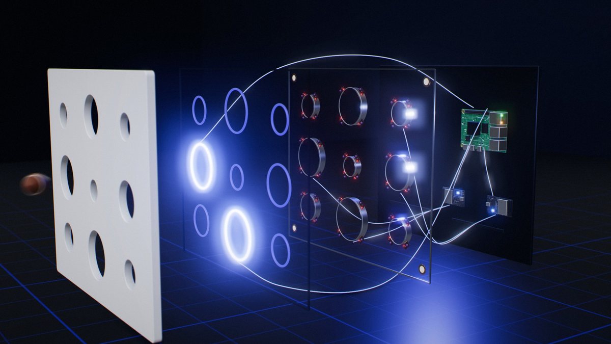 The wall pulled apart into its layers: the white face with a ball arriving, a layer of light rings with two lit, a layer of sensor collars around every target, and the back plate with two controller boards and a small computer, joined by lines of light.