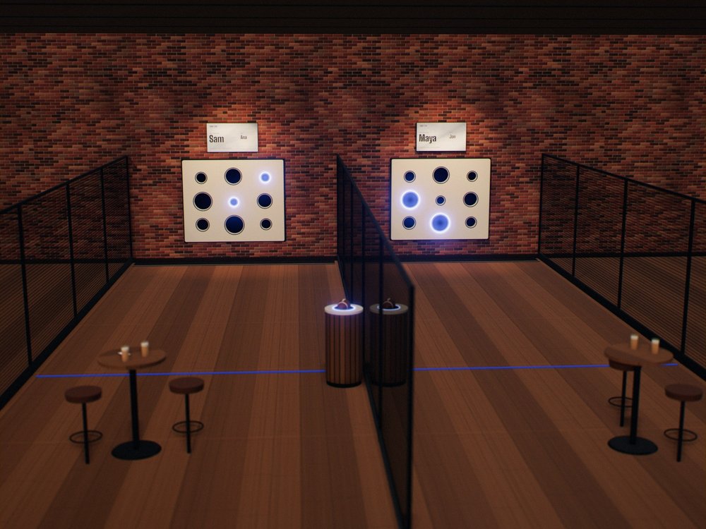 Two Third Zone bays in a large hall, seen from a mezzanine: black sports nets run from the wall past the floor lines, a shared ball return stands between the lanes, and each bay has its own high-top table.